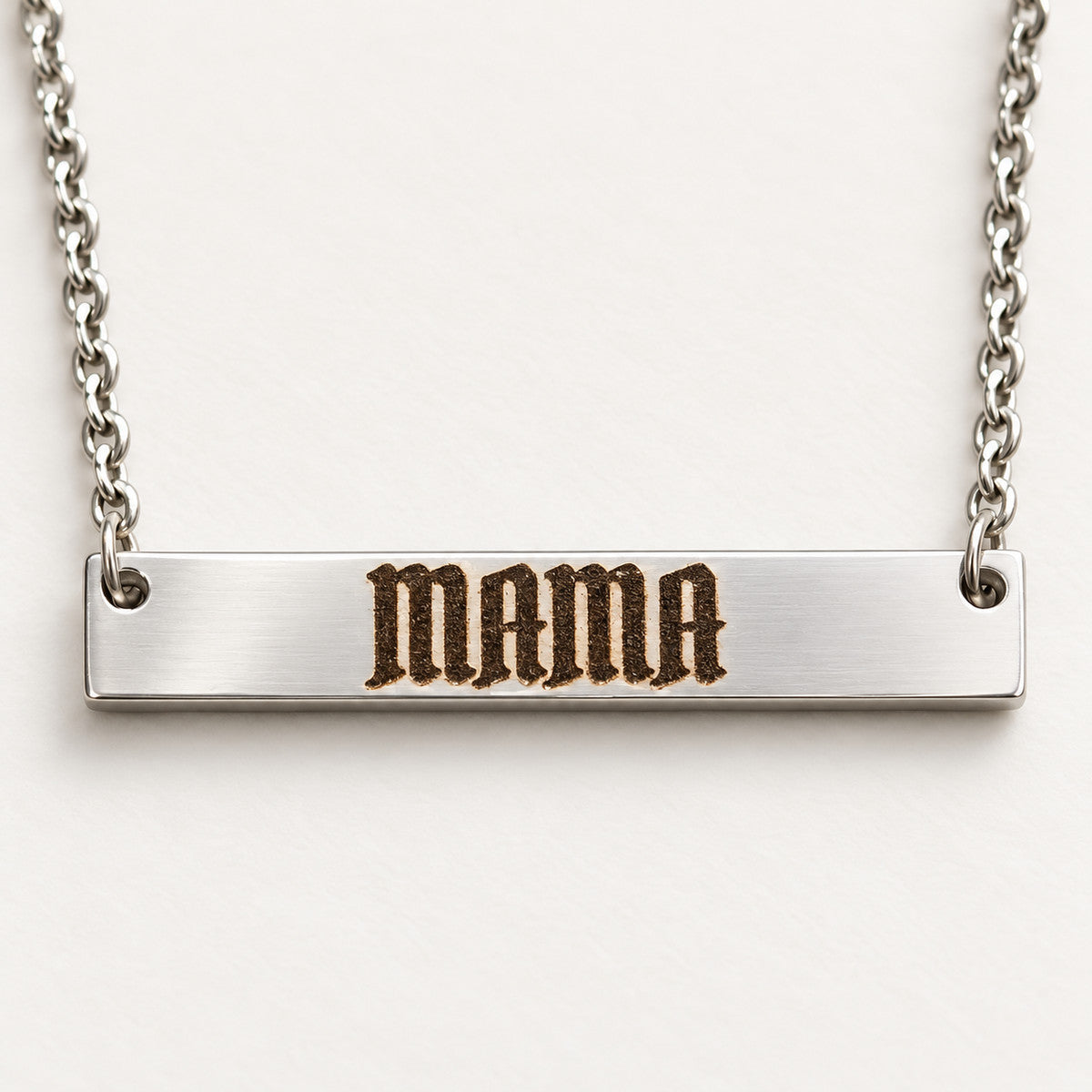 Silver Bar Necklace engraved MAMA in blackletter, shown as a finished personalization example.