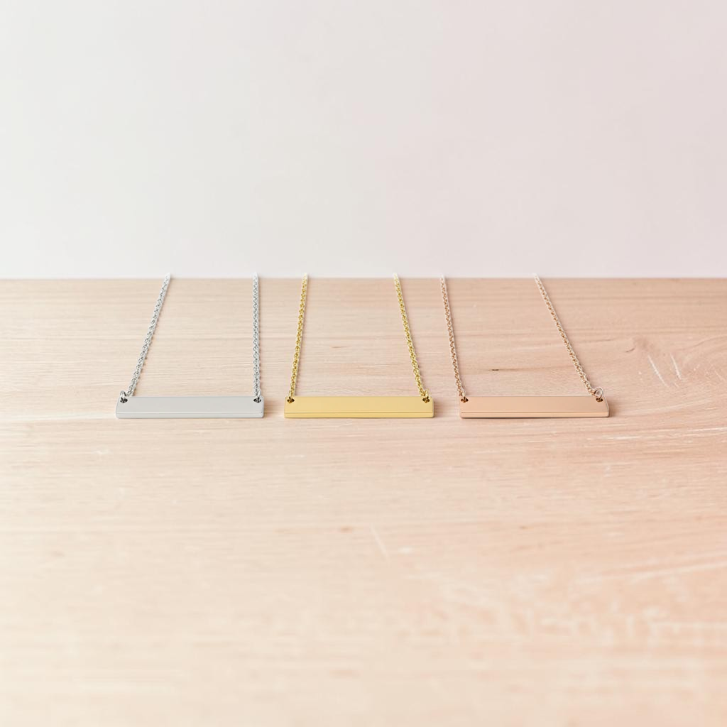 Roco Engraving custom bar necklaces in silver, gold, and rose gold stainless steel with polished mirror finish.