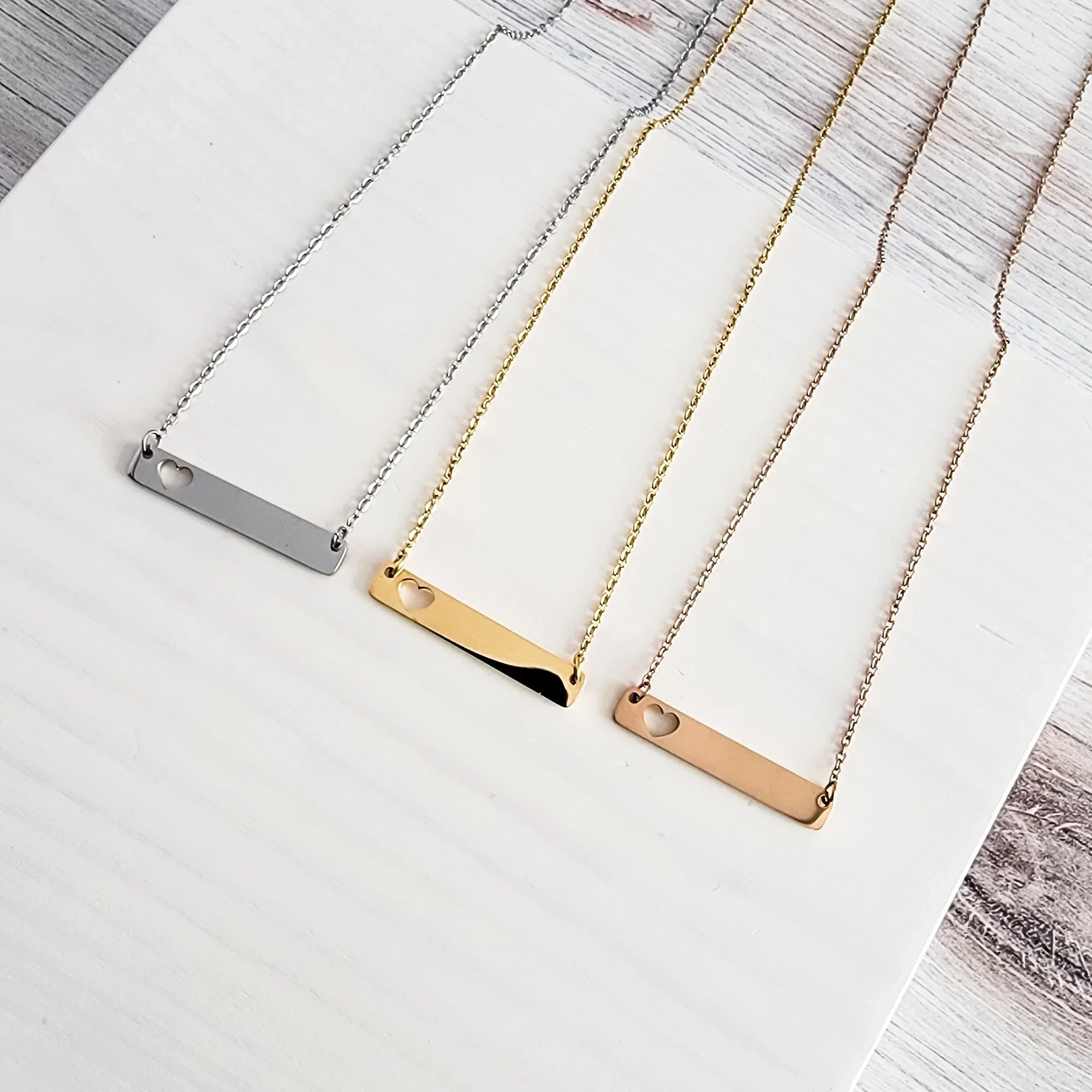 Roco Engraving custom heart bar necklaces in silver, gold, and rose gold stainless steel with mirror finish