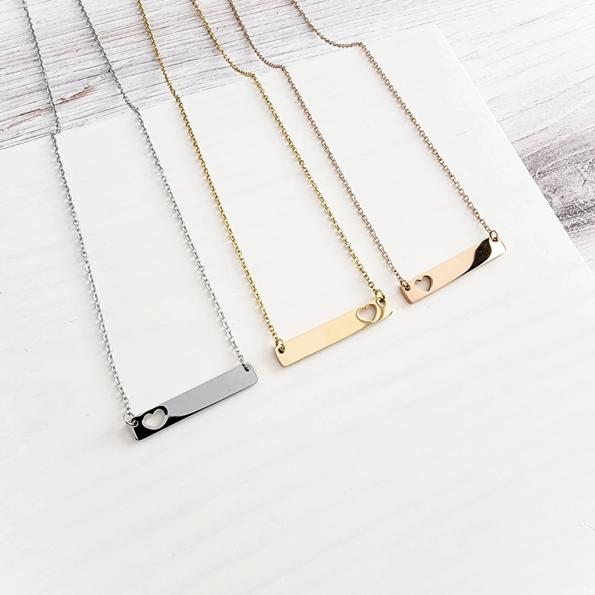 Roco Engraving custom heart bar necklaces in silver, gold, and rose gold stainless steel with mirror finish