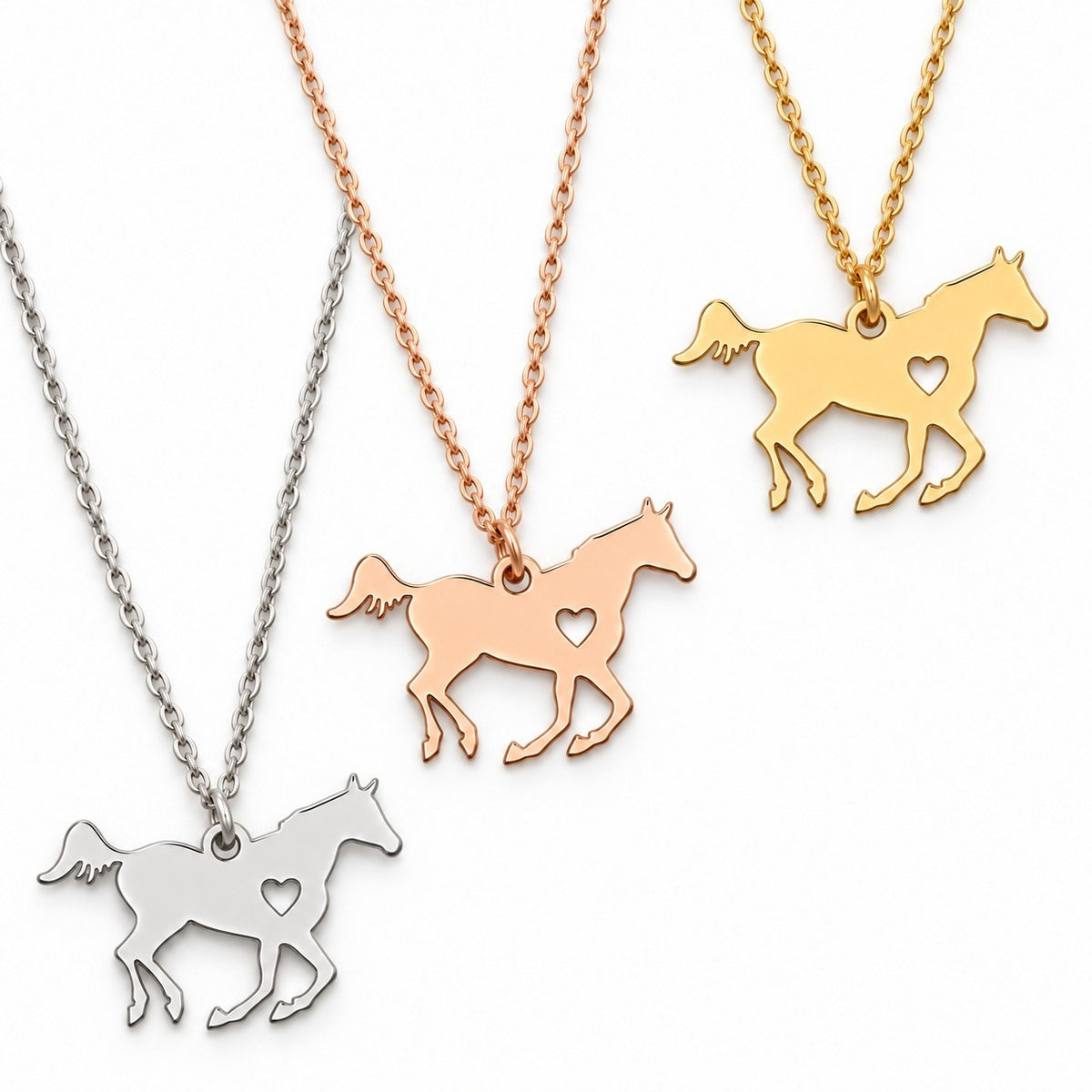 Gold, Silver and Rose Gold Horse Necklace finishes. Each purchase includes one necklace with a pouch, not three necklaces.
