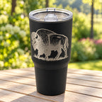 Black 30oz MakerFlo tumbler engraved with the Buffalo design, outdoors