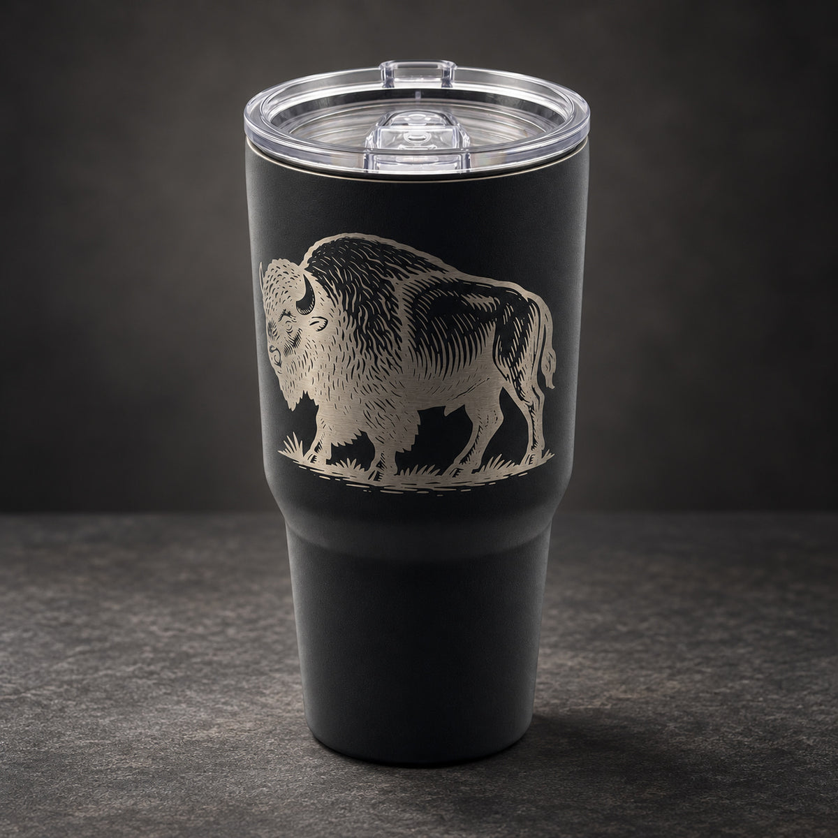 Black 30oz MakerFlo tumbler engraved with the Buffalo design, studio lighting