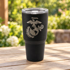 Black 30oz MakerFlo tumbler engraved with the Marines Emblem design, outdoors