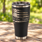 Black 30oz HOGG Modern Curve tumbler engraved with the We the People design, outdoors